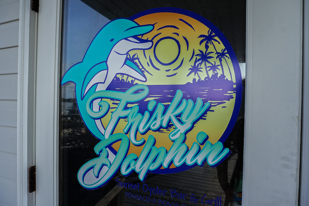 Frisky Dolphin logo